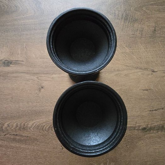 A pair of black candle holders
