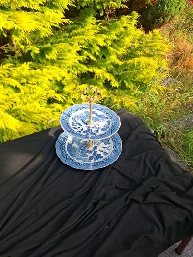 Blue willow style cake stand light chip at the back