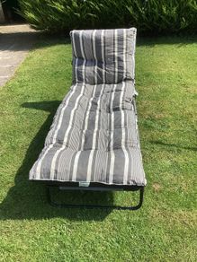 Sunbed and padded cushion