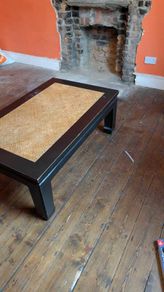 coffee table, black lacquered with rattan inset