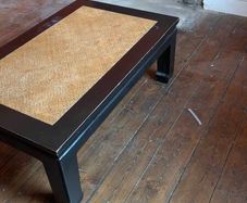 coffee table, black lacquered with rattan inset