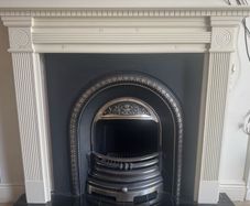 fireplace wooden surround and cast iron back plate