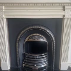 fireplace wooden surround and cast iron back plate