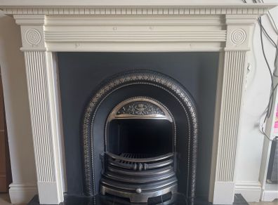 fireplace wooden surround and cast iron back plate