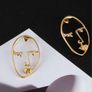 Golden Artistic Face-Shaped Earrings Minimalist Statement Jewelry Image 3