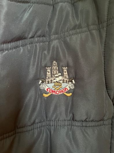 O'Neills CORK GAA Padded Puffer Gilet  jacket Navy. CORCAIGH. Detachable hood.  Size small adult. In Excellent condition