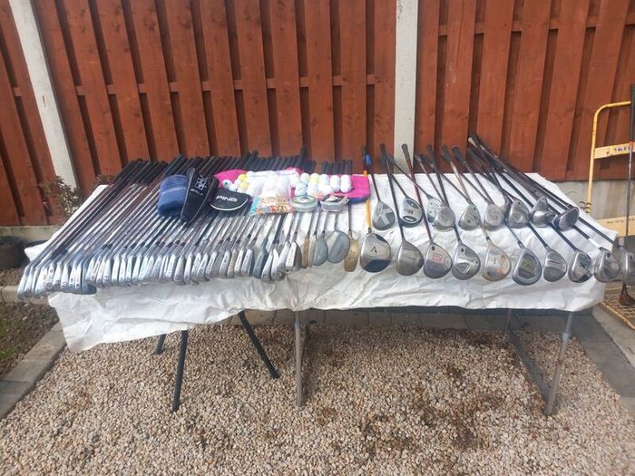 A selection of golf clubs and bags. Golf balls