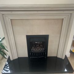 stone fireplace with gas fire
