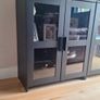 2 black cabinets with glass doors and shelves Image 2