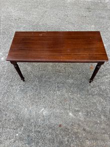 Dark wood coffee table with turned legs