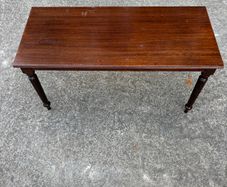Dark wood coffee table with turned legs