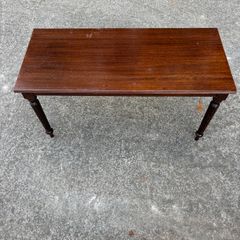Dark wood coffee table with turned legs