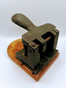 Vintage cast iron hole punch
