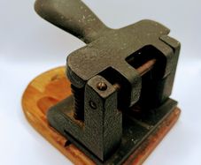 Vintage cast iron hole punch