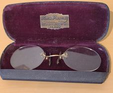 Very collectable vintage clip on glasses from Nora Mooney optician's