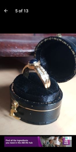 18 ct gold ring with Sapphire stone and 16 brilliant cut diamonds