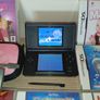 Nintendo ds lite in black with charger and games all in good working order Image 2