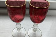 Pair of cranberry glass gold etched antique wine glasses