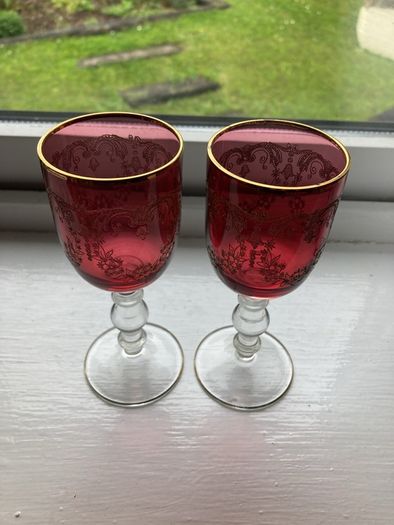 Pair of cranberry glass gold etched antique wine glasses