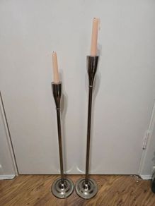Pair of Meadows and Byrne tall silver floor candle holders
