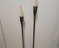 Pair of Meadows and Byrne tall silver floor candle holders