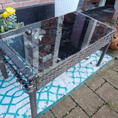 small rattan and glass table