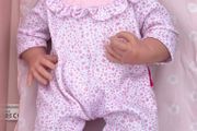 Baby doll with pink onesie EUC