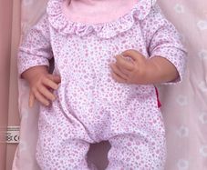 Baby doll with pink onesie EUC