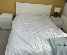 bed with 2 matching bedside lockers
