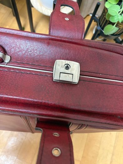 Vintage burgundy faux-leather suitcase