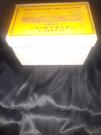 Clarkes Pyramid lamp night light and an Advertisment Box, comprising a white glazed ceramic reservoir marked Prices Patent Candle Company Limited, London