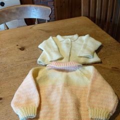 Baby Handkitted cardigans, one pink and yellow. And one plain yellow. New never worn.