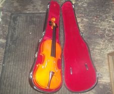 a vintage fiddle with case,needs strings child violin