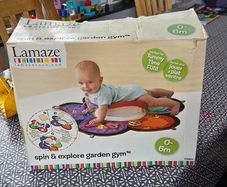 Lamaze Spin and Explore Garden Gym baby activity mat