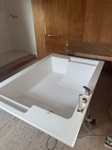 Brand new two person bath with fittings