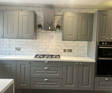 grey shaker Kitchen Units, white spec worktops, gas hob with glass extractor and FRANKE sink included.