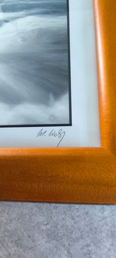 Framed Photograph art print depicting a rushing stream or waterfall, labeled -Glendalough - Co Wicklow- and hand-signed by the artist by Michael Walsh.