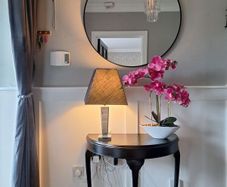 Hall table with lamp and orcid ornament