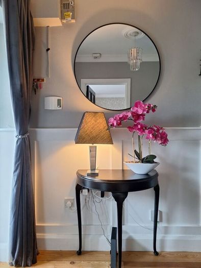 Hall table with lamp and orcid ornament