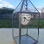 Table clock in a glass lantern. Image 2