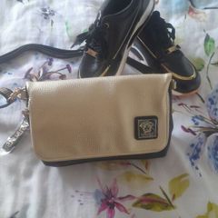 Selling  both together bag new with tags amd black and gold ladies trainers