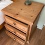 Solid antique pine three-drawer bedside locker Image 4