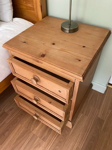 Solid antique pine three-drawer bedside locker