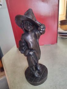 Genesis Sculpture Of A Small Girl Dressing Up With Her Moms Clothes