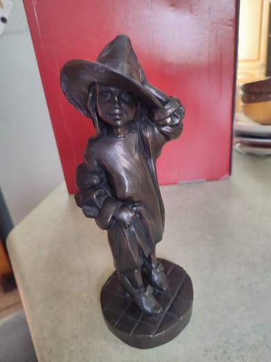 Genesis Sculpture Of A Small Girl Dressing Up With Her Moms Clothes