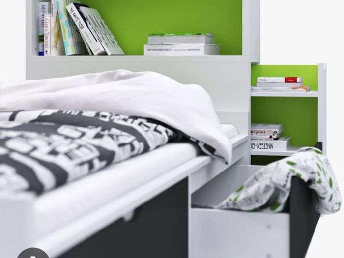 Ikea Flaxa bed with storage headboard.