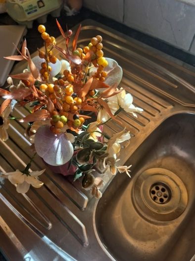Small orange and tan fake flowers