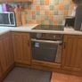 Wooden kitchen cabinets with dish washer and oven Image 9