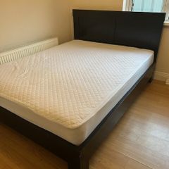 Solid black wooden kingsize bed