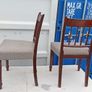 Two vintage mahogany dining chair with a pediment-style top rail, turned spindle back and turned front legs seat in a textured gray fabric Image 4